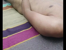 Young straight Indian man masturbates outdoors.