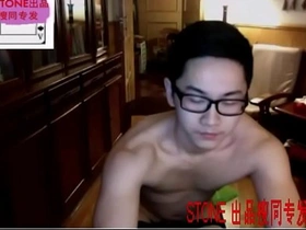 Muscular Chinese man masturbates in camouflage print socks and underwear.