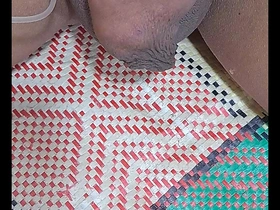 Gay man from Myanmar injecting saline solution in a homemade video.