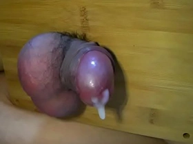 Solo boy enjoys ballbusting and a huge cock cumshot