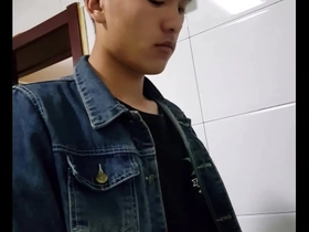 Young Asian boy urinates