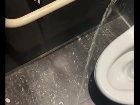 Gay college boy urinates in the toilet