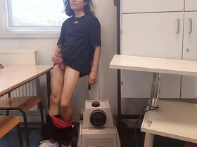 A young and horny student, Jon Arteen, pleasuring himself in a classroom while a classmate watches.