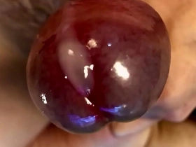Close up of a facial with a solo boy who masturbates.
