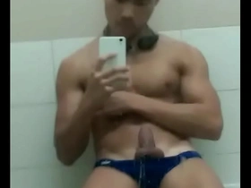 Hot Asian man masturbates by the pool.