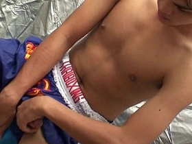 Gay Asian twink masturbates.