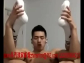 Young Asian boy masturbates and cums on camera